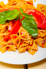 Image showing Italian pasta farfalle butterfly bow-tie and tomato sauce