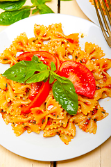 Image showing Italian pasta farfalle butterfly bow-tie and tomato sauce