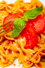 Image showing Italian pasta farfalle butterfly bow-tie and tomato sauce