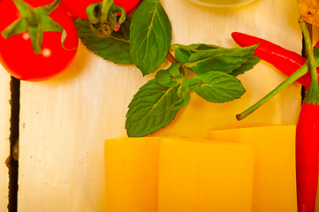 Image showing Italian pasta paccheri with tomato mint and chili pepper