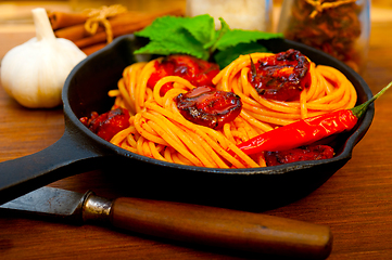 Image showing italian spaghetti pasta and tomato with mint leaves