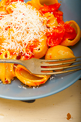 Image showing Italian snail lumaconi pasta with tomatoes