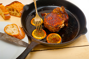 Image showing pork chop seared on iron skillet