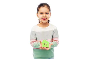 Image showing smiling little girl holding green house icon