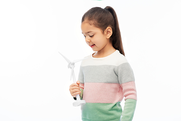 Image showing smiling girl with toy wind turbine