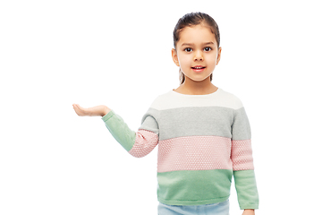 Image showing happy smiling girl holding something imaginary