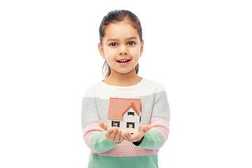 Image showing smiling girl holding house model