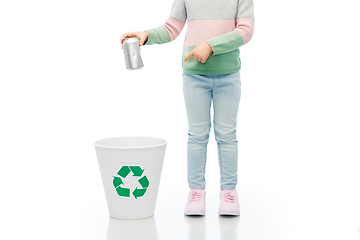 Image showing girl throwing tin can into rubbish bin