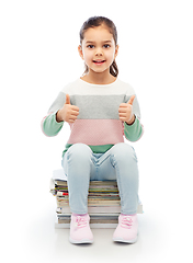 Image showing smiling girl with magazines sorting paper waste