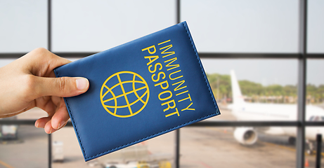 Image showing close up of hand holding immunity passport