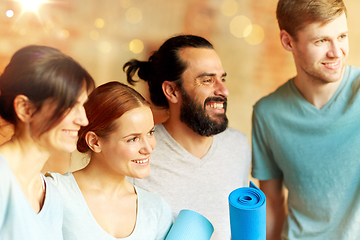 Image showing group of people with mats at yoga studio or gym