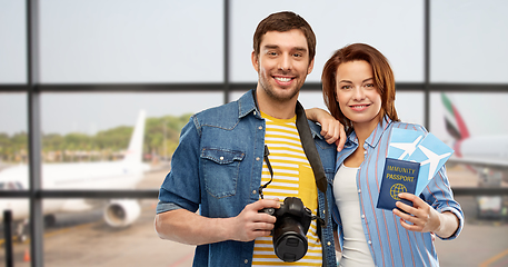 Image showing couple with tickets, immunity passport and camera