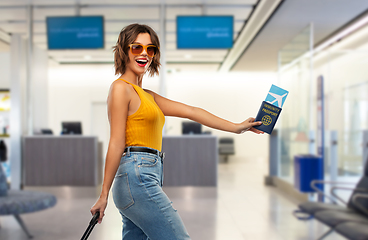 Image showing happy woman with air ticket and immunity passport