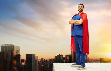 Image showing doctor or male nurse in superhero cape in city
