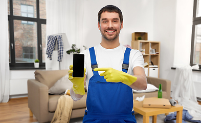 Image showing male worker or cleaner showing smartphone at home