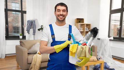 Image showing male cleaner with cleaning supplies at home