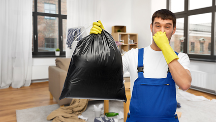 Image showing male worker or cleaner with garbage bag at home