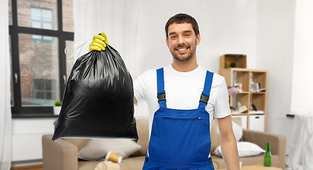 Image showing male worker or cleaner with garbage bag at home