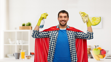 Image showing smiling man in superhero cape with rag and cleaner