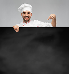 Image showing happy smiling male chef with big black chalkboard