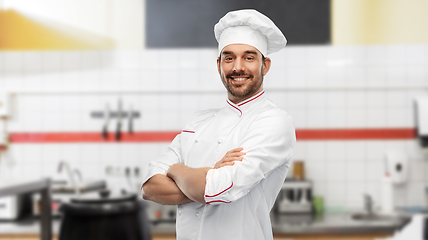 Image showing happy smiling male chef at restaurant kitchen