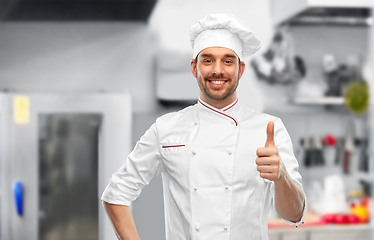 Image showing smiling male chef in toque showing thumbs up