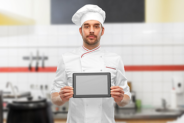 Image showing male chef showing tablet pc at restaurant kitchen