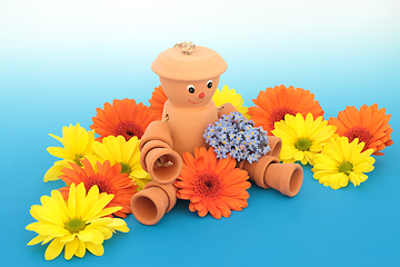 Image showing Flowerpot Man Garden Ornament and Summer Flowers