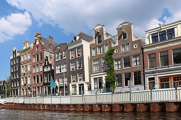 Image showing Amsterdam downtown, Traditional old houses and a canals. Holland