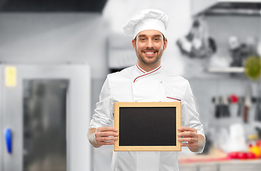 Image showing happy smiling male chef showing chalkboard