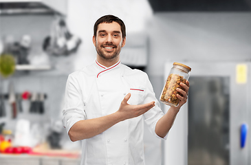 Image showing happy smiling male chef with pasta in glass jar