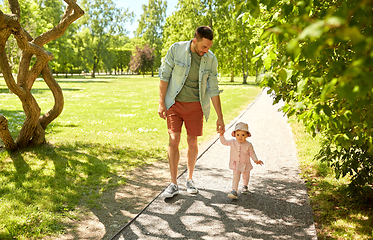 Image showing happy father with baby daughter walking at park