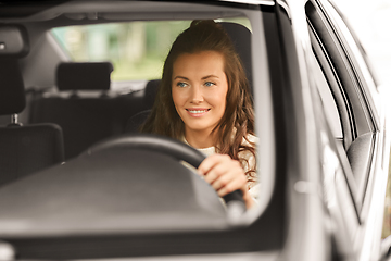 Image showing woman or female driver driving car in city