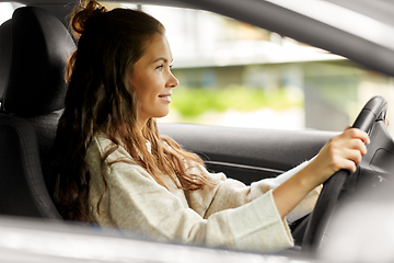 Image showing woman or female driver driving car in city