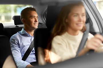 Image showing female driver driving car with male passenger