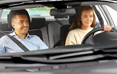 Image showing car driving school instructor teaching woman