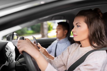 Image showing car driving school instructor teaching woman