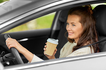 Image showing woman or female driver with coffee driving car
