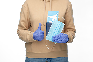 Image showing woman with mask, passport and air ticket