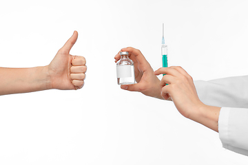 Image showing hand with medicine and showing thumbs up