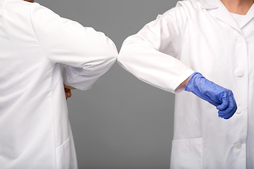 Image showing close up of doctors make elbow bump gesture