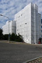 Image showing Scaffold in front of building facade covered with fabric