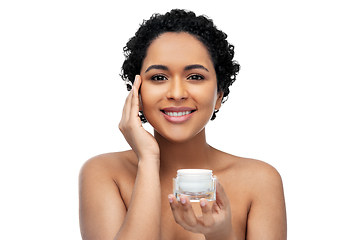 Image showing young african american woman with moisturizer