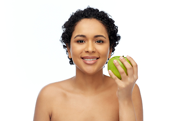 Image showing happy african american woman holding green apple