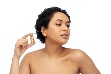 Image showing african american woman with gold mask in bottle