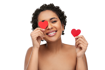 Image showing african american woman covering eyes with hearts