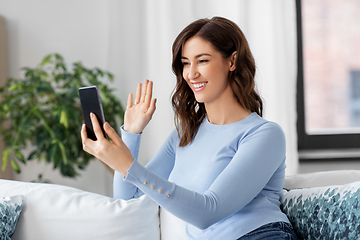 Image showing woman with smartphone having video call at home