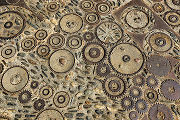 Image showing Unusual floor with pattern from pebbles and rusty metal details