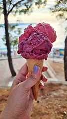 Image showing Gelato ice cream cone held up to the hot summer city