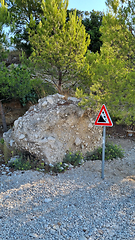 Image showing Attention sign for rock fall. Attention sign Falling rocks. Biokovo Mountain Nature park and trees from Makarska Riviera-Biokovo, Dalmatia, Croatia, Europe